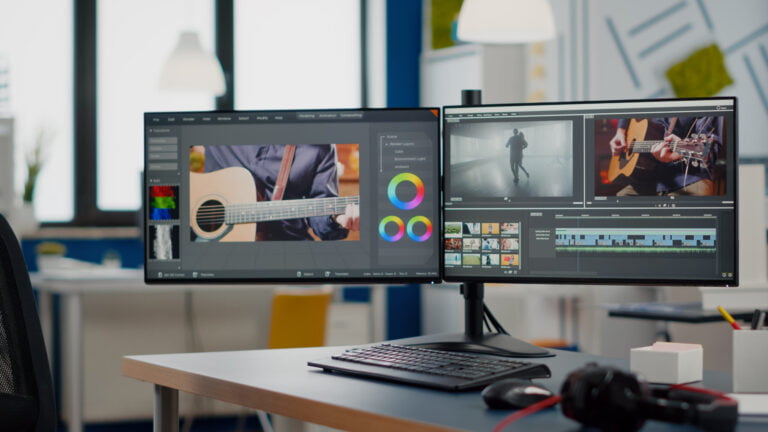 Video production studio setup with dual monitors and editing software.