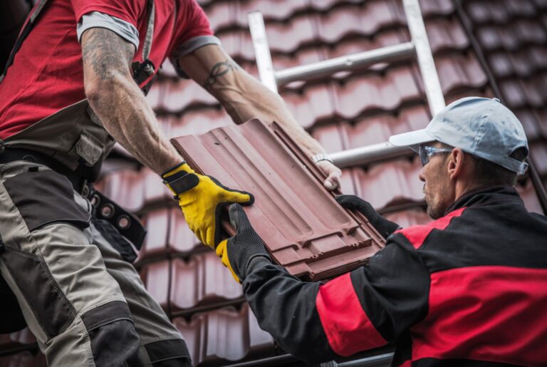 Roofers installing red roof tiles, roofing calculator advantages