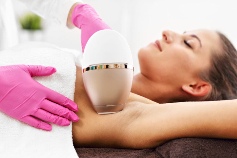 Woman receiving laser hair removal treatment in professional setting, style and beauty advice.